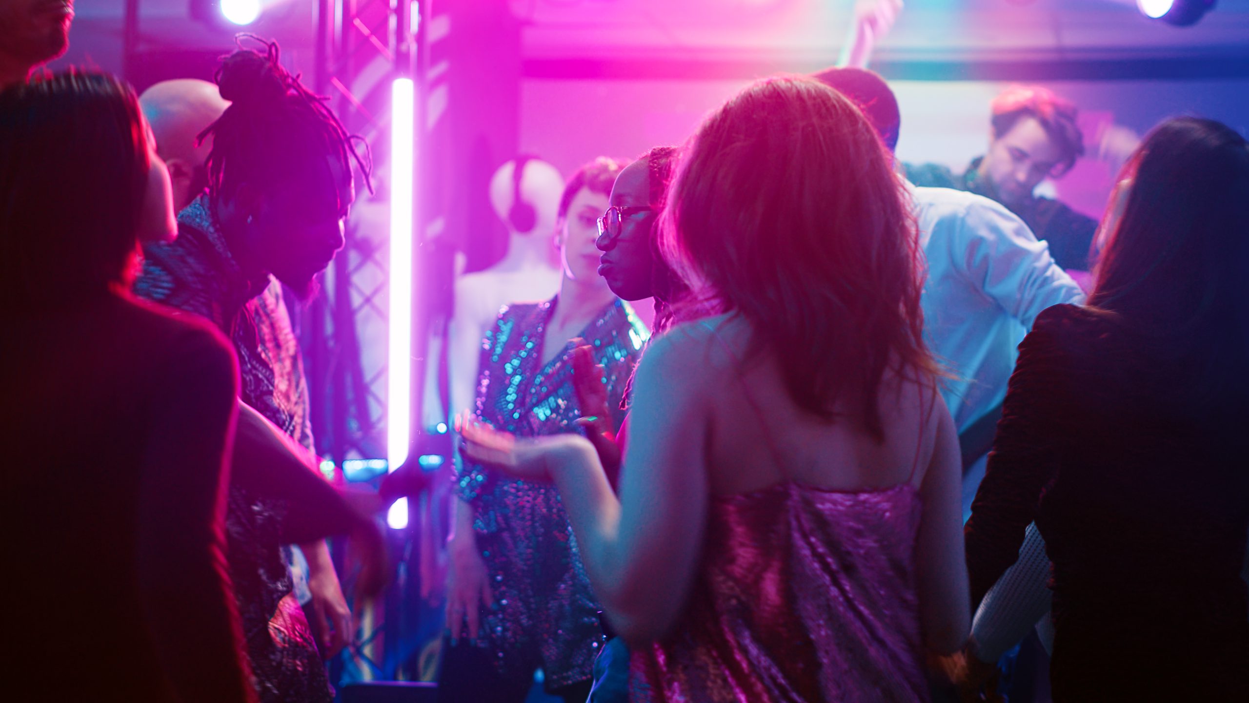 Cheerful persons doing dance moves